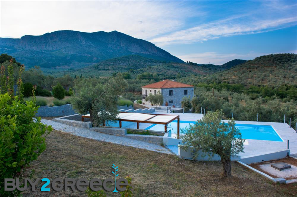 B265 – A complex of two floor traditional stone houses in Epidaurus , Greece.